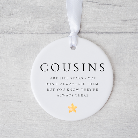 A ceramic heart-shaped cousin gift coaster with a sentimental quote, a thoughtful keepsake to celebrate the bond between cousins