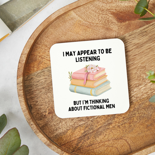 Funny book lover coaster featuring a witty fictional men design. A glossy 9x9cm coaster, perfect for readers, romance book fans, Secret Santa gifts, and book lovers.