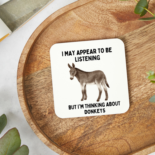 Funny donkey coaster featuring a humorous donkey-themed design. Glossy 9x9cm coaster, perfect for donkey lovers, animal fans, Secret Santa gifts, birthdays, or everyday use.