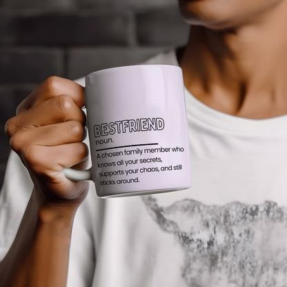 White ceramic mug with “Bestfriend noun.” definition style quote in black typography, featuring a heartfelt and funny description about friendship and support, displayed on a neutral wooden background.