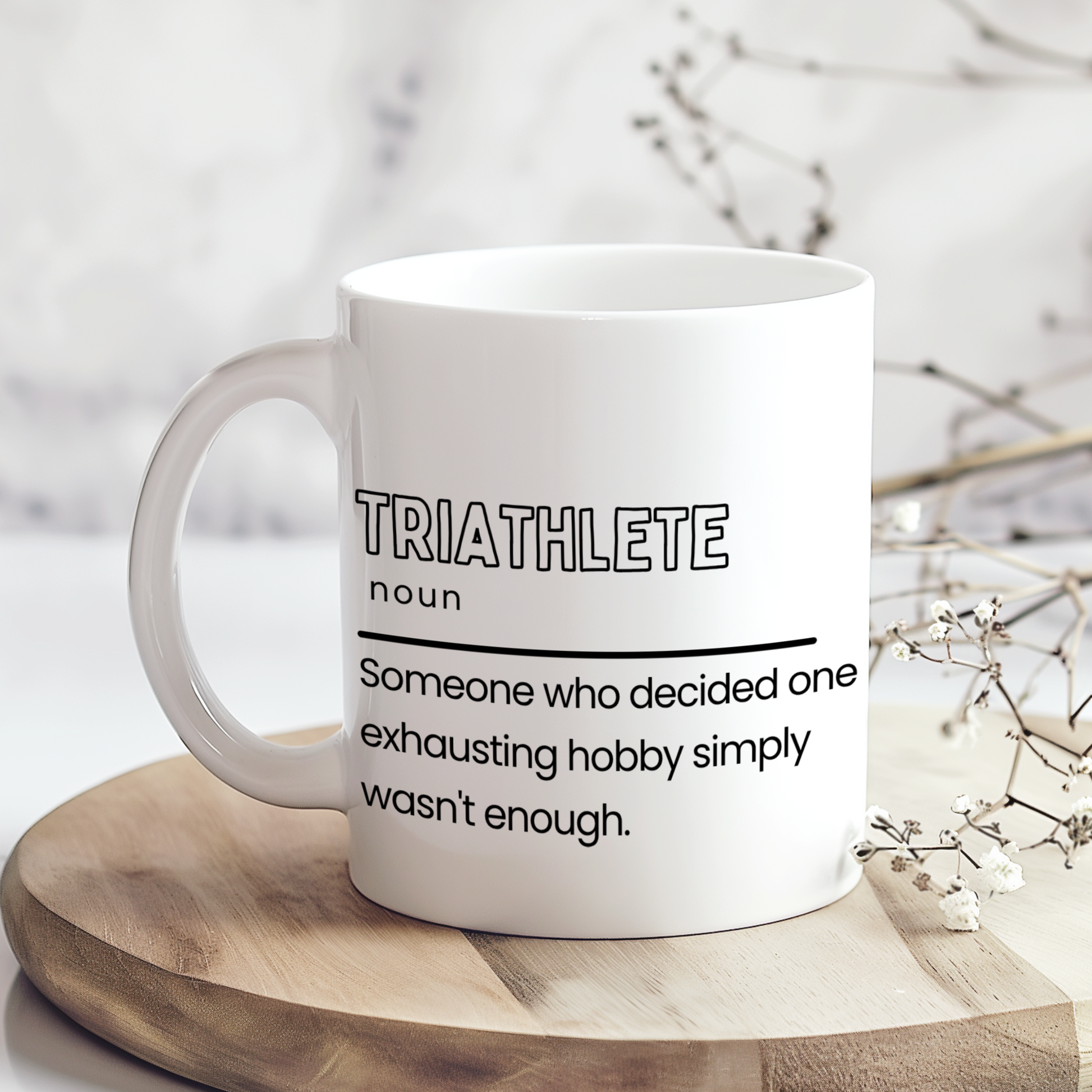 Funny triathlete definition printed on a white 11oz ceramic mug
