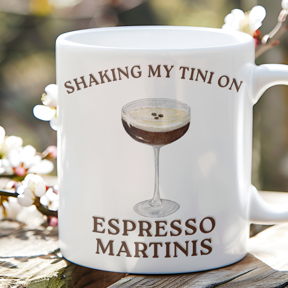 Glossy white mug with an espresso martini illustration and Shaking My Tiny on Espresso Martinis slogan.