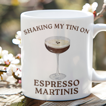 Glossy white mug with an espresso martini illustration and Shaking My Tiny on Espresso Martinis slogan.