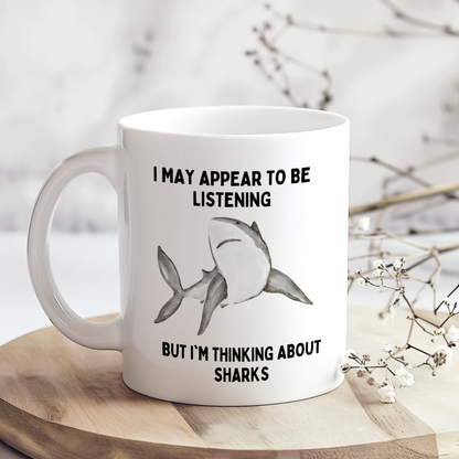 White mug featuring a funny shark-themed design, ideal for shark lovers, ocean enthusiasts and anyone obsessed with sharks.