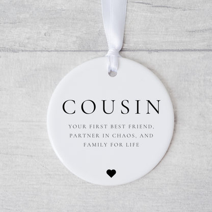 A ceramic heart-shaped cousin gift coaster with a sentimental quote, a thoughtful keepsake to celebrate the bond between cousins