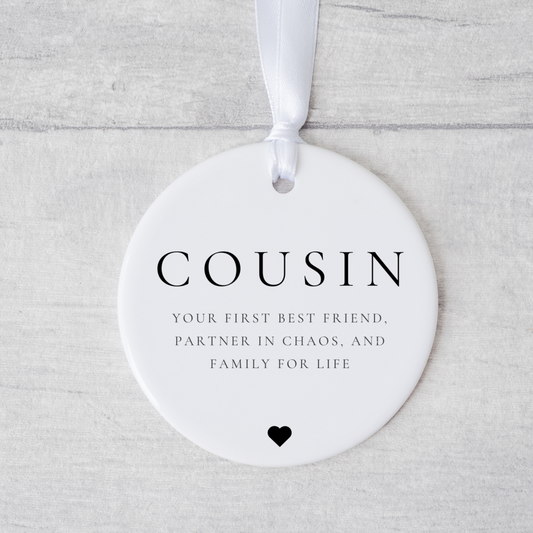 A ceramic heart-shaped cousin gift coaster with a sentimental quote, a thoughtful keepsake to celebrate the bond between cousins