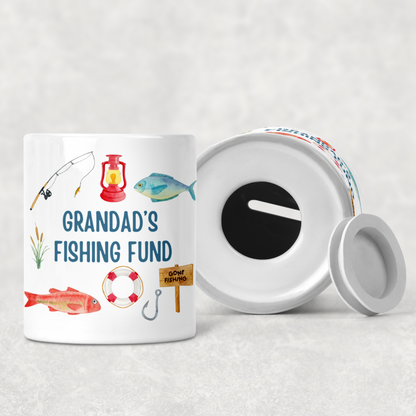 Personalised fishing money box with coin slot on top and rubber stopper at the bottom. Compact ceramic saving pot, 9.3cm tall by 8cm wide, ideal gift for fishing lovers and Father’s Day