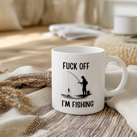 Glossy white ceramic mug with a funny fishing-themed design, perfect for fishermen and fishing lovers.