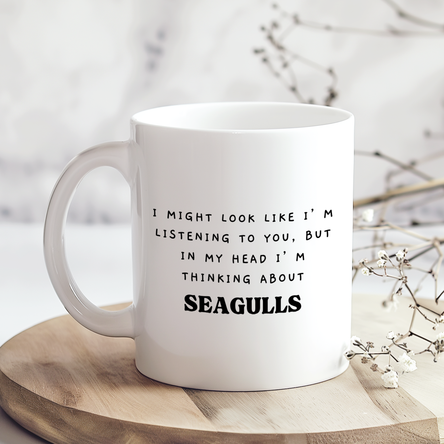“White 11oz ceramic mug with a glossy finish featuring a funny seagull design printed on both sides.”