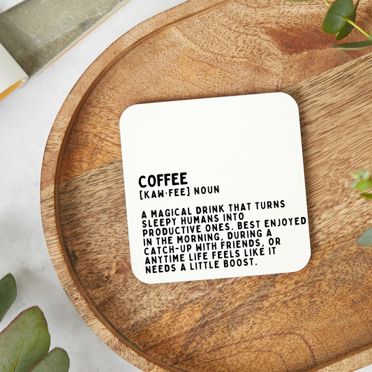 Funny coffee lover coaster featuring a humorous dictionary style definition design in minimalist black typography on a white background.