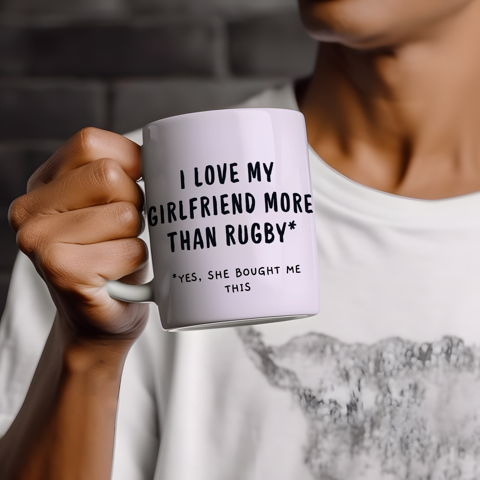 White glossy ceramic mug with “I Love My Girlfriend More Than Rugby” text printed on both sides, funny Valentine’s Day gift for rugby-loving couples.
