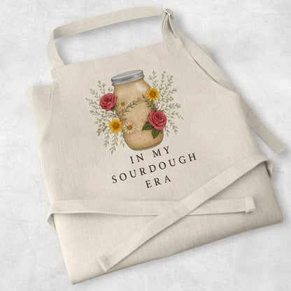 White cotton cooking apron with 'Sourdough Lover' design, perfect for baking enthusiasts and thoughtful mum gifts