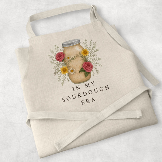 White cotton cooking apron with 'Sourdough Lover' design, perfect for baking enthusiasts and thoughtful mum gifts