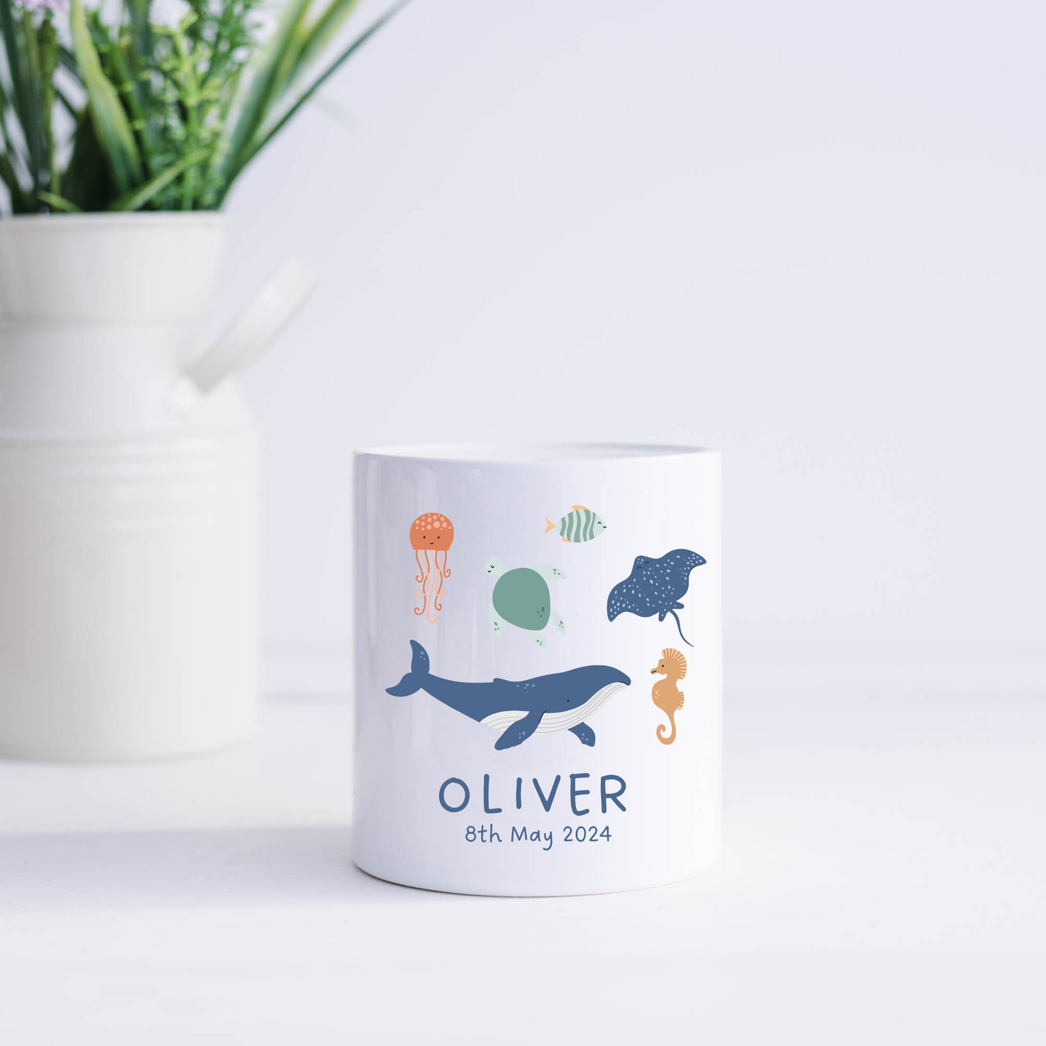 Personalised ceramic ocean theme money box for children with coin slot and rubber stopper, perfect for nursery decor or baby gift.