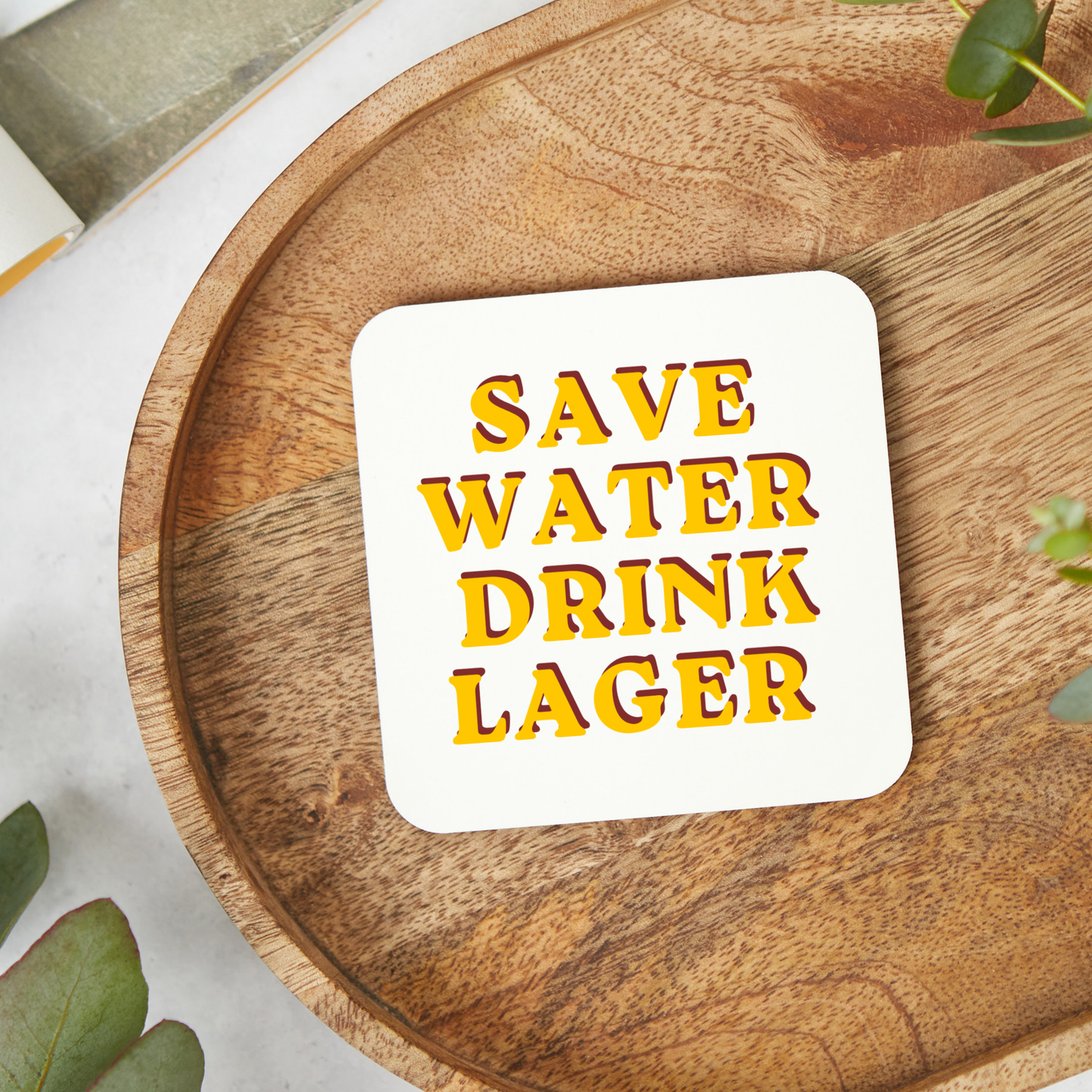 Retro style “Save Water Drink Lager” coaster with bold yellow and red typography on a white square glossy coaster, funny beer lover gift, pub inspired drink coaster with hardboard backing, 9x9cm easy wipe clean coaster