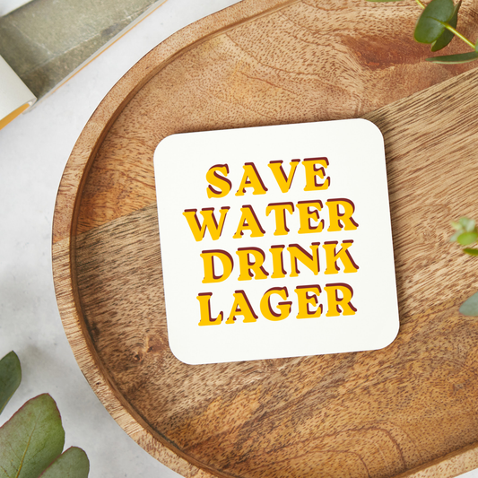 Retro style “Save Water Drink Lager” coaster with bold yellow and red typography on a white square glossy coaster, funny beer lover gift, pub inspired drink coaster with hardboard backing, 9x9cm easy wipe clean coaster