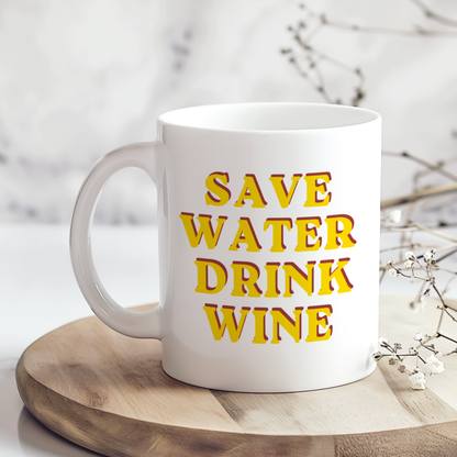 White ceramic mug with retro yellow and pink typography reading “Save Water Drink Wine”, held in hand lifestyle mockup, funny wine lover gift mug, glossy finish coffee cup