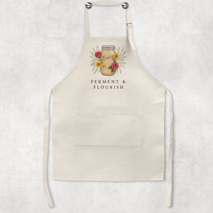 Beige apron with floral design and text on a light gray background