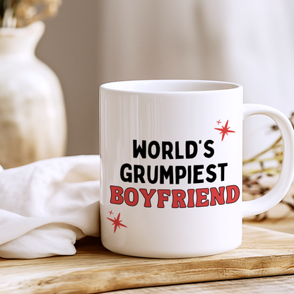 White glossy ceramic mug with funny “World’s Grumpiest Boyfriend” text printed on both sides, humorous novelty gift for boyfriend.
