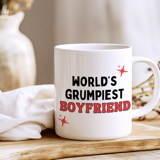 White glossy ceramic mug with funny “World’s Grumpiest Boyfriend” text printed on both sides, humorous novelty gift for boyfriend.