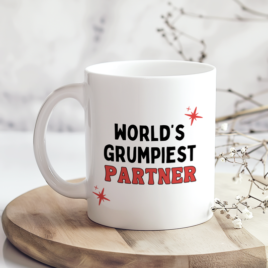White glossy ceramic mug with funny “World’s Grumpiest Partner” text printed on both sides, humorous novelty gift for partner.