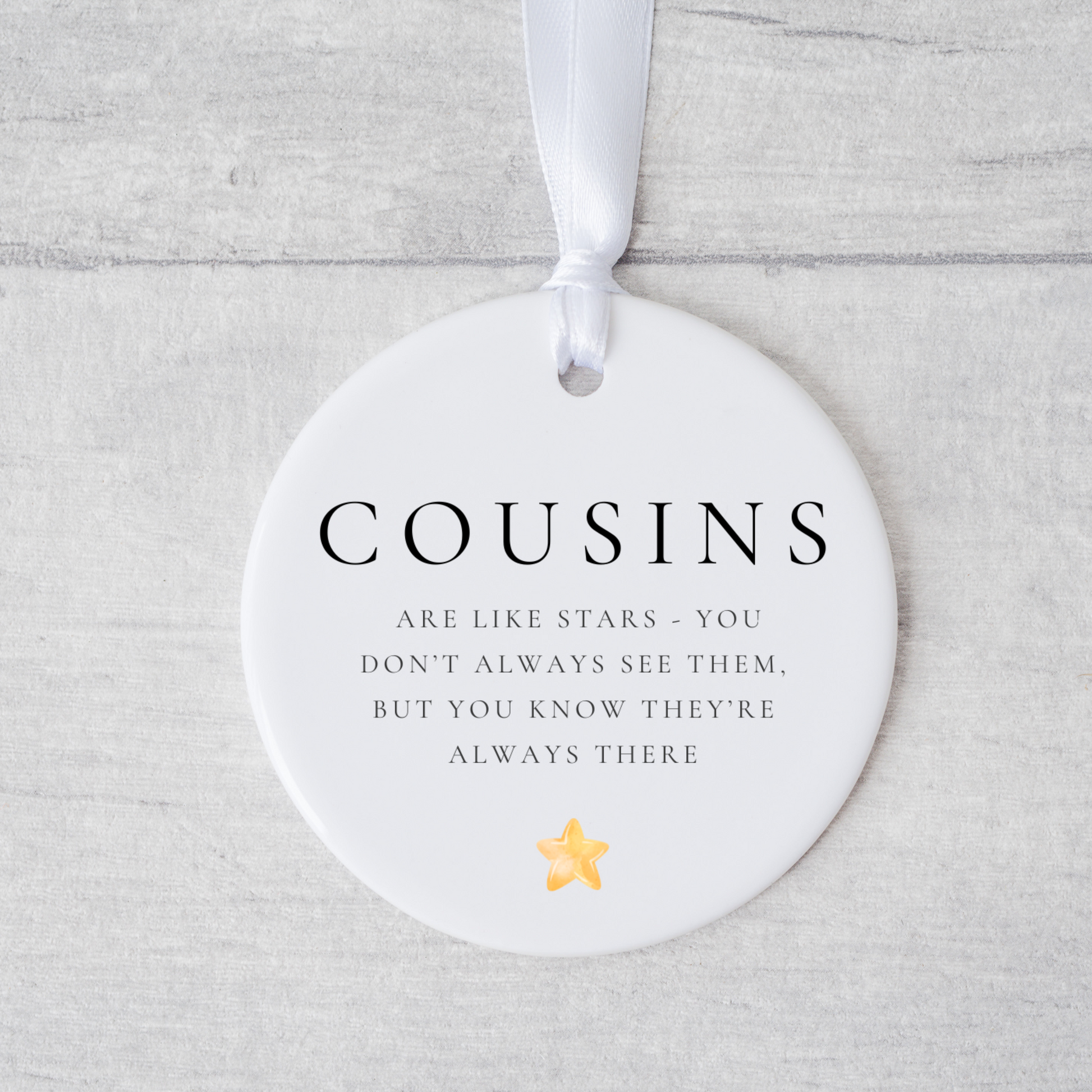 A ceramic heart-shaped cousin gift coaster with a sentimental quote, a thoughtful keepsake to celebrate the bond between cousins