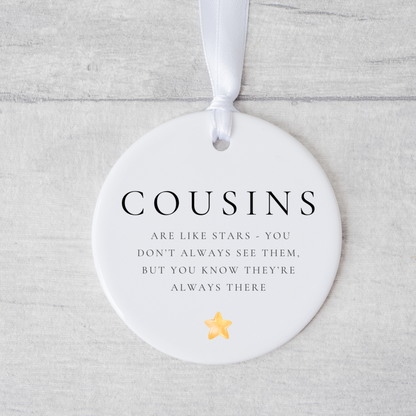 A ceramic heart-shaped cousin gift coaster with a sentimental quote, a thoughtful keepsake to celebrate the bond between cousins