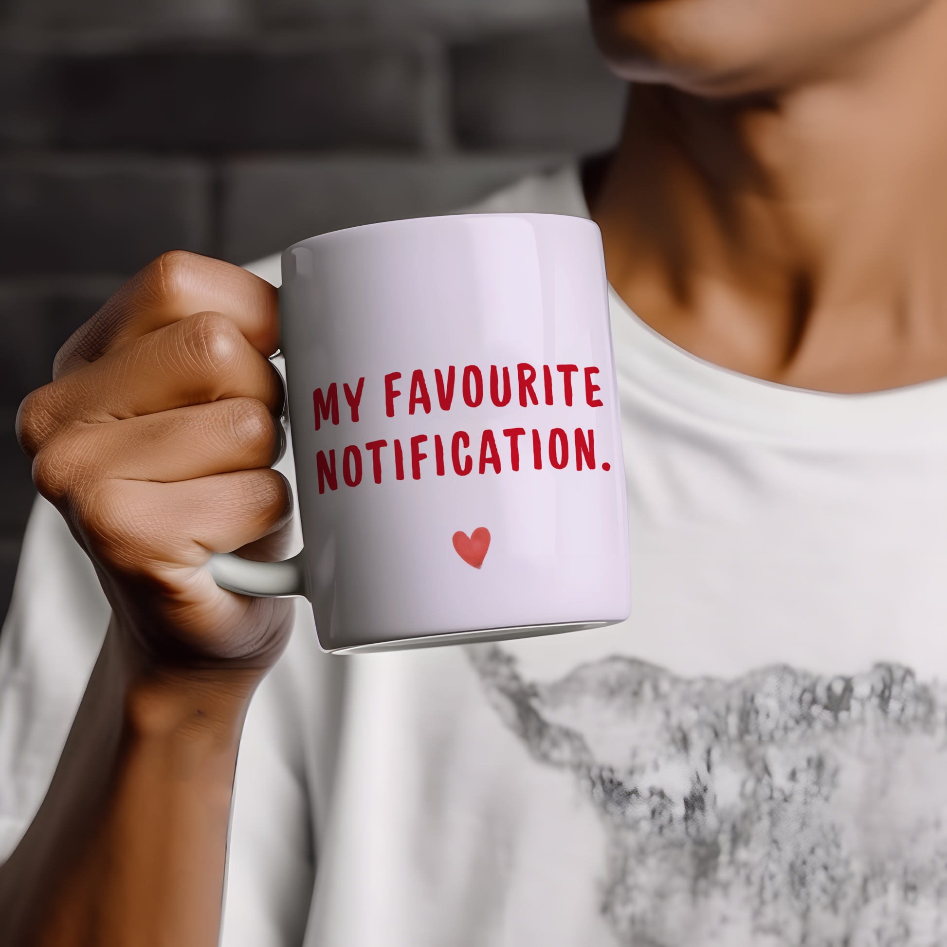 White glossy ceramic mug with “My Favourite Notification” text printed on both sides, cute and funny Valentine’s Day gift for couples.