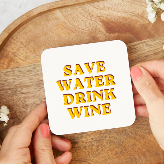 White ceramic mug with retro yellow and pink typography reading “Save Water Drink Wine”, held in hand lifestyle mockup, funny wine lover gift mug, glossy finish coffee cup